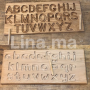 Planche en bois d'alphabets pour apprendre l'écriture
